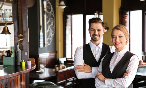 Server using a handheld POS device to take an order